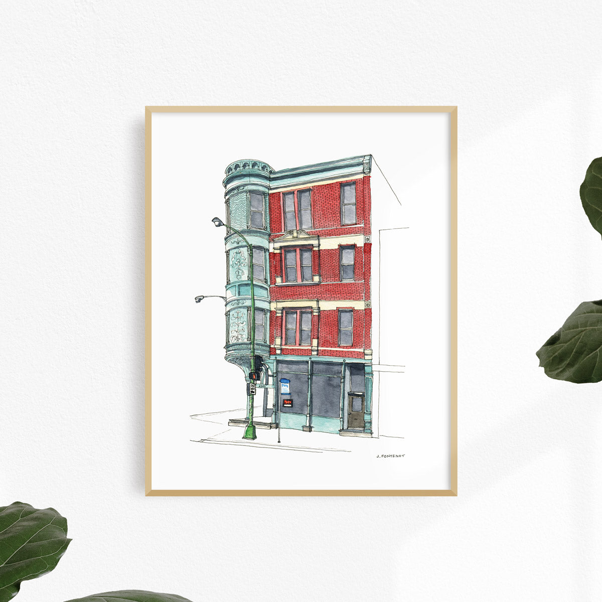 Watercolor painting and ink drawing of red brick building in Chicago art print framed on a white wall. Framed wall art