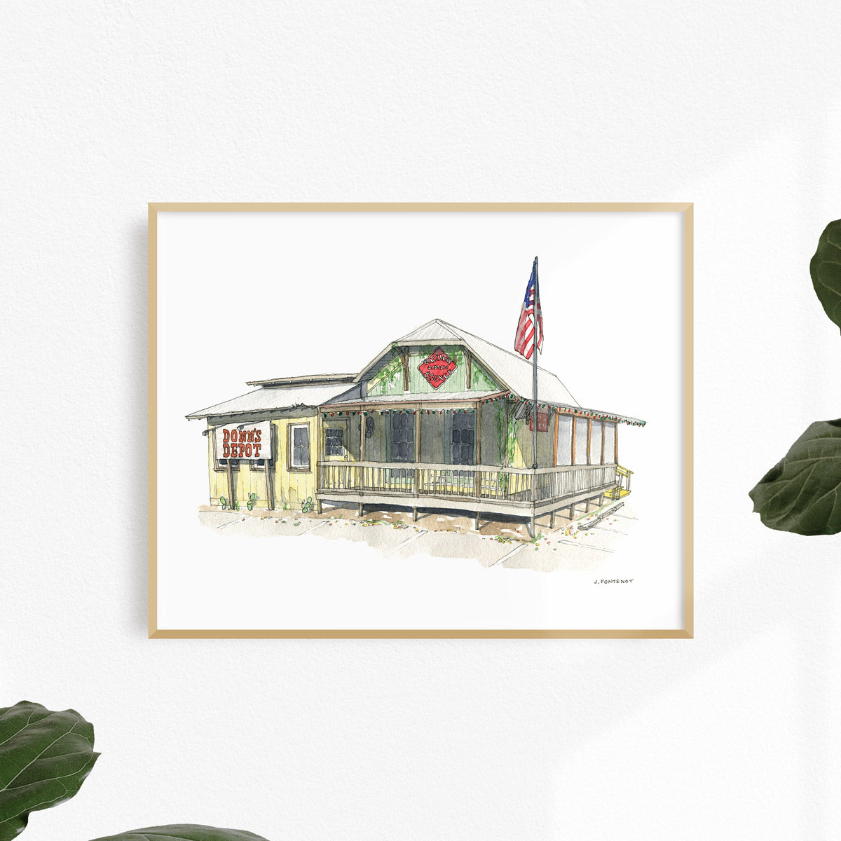 Watercolor painting and ink drawing of Donn's Depot in Austin, Texas art print framed on a white wall. Framed wall art