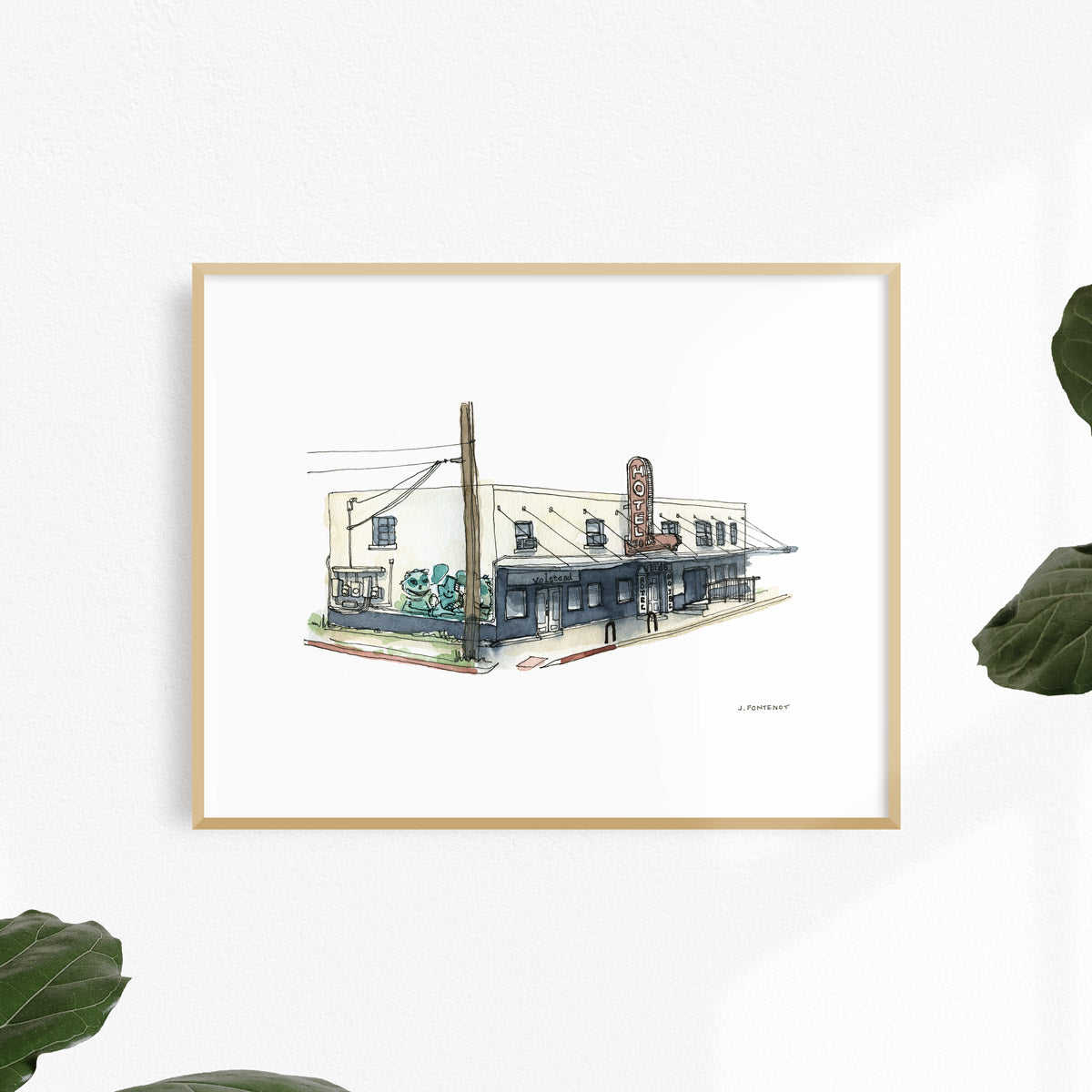 Watercolor painting and ink drawing of Hotel Vegas in East Austin art print framed on a white wall.