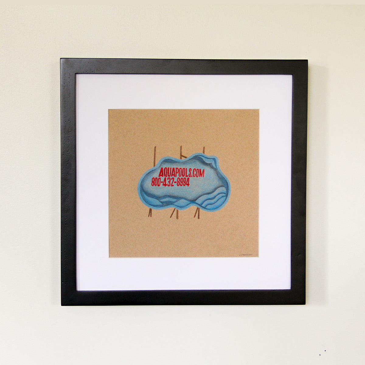 The framed colored pencil drawing of a blue plastic pool shell on its side with a 2 inch white matte around the art and a black wood frame. Framed wall art.