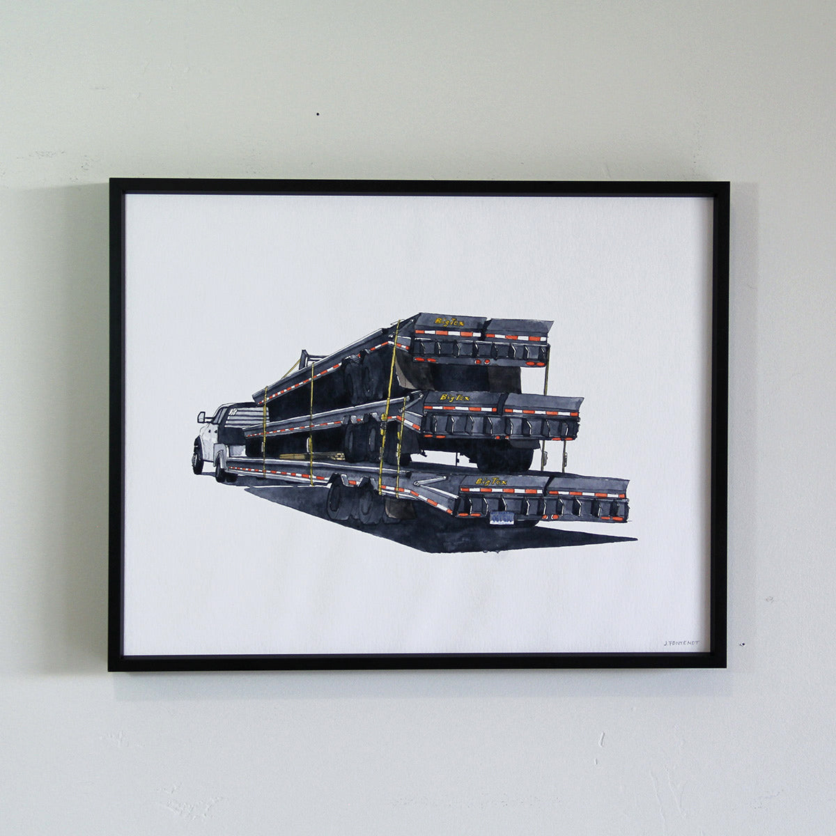 Framed original art hung on the wall in thin black metal frame. Watercolor painting of stacked truck flatbeds.