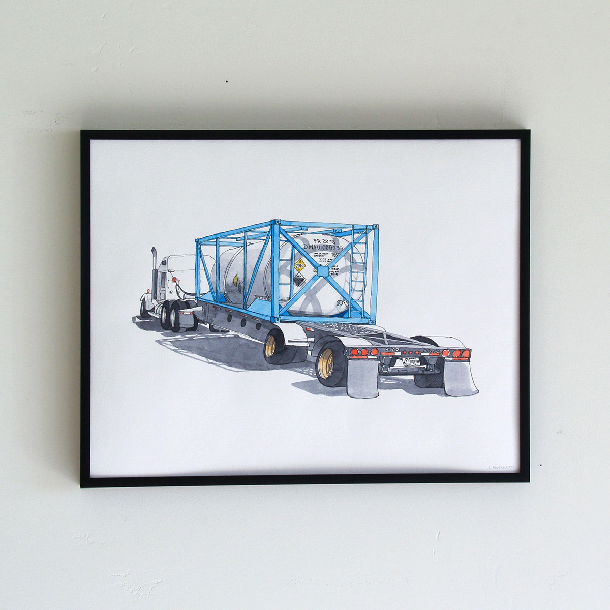 Framed original artwork hung on wall in thin black metal frame. Watercolor painting of 18-wheeler truck with tank.