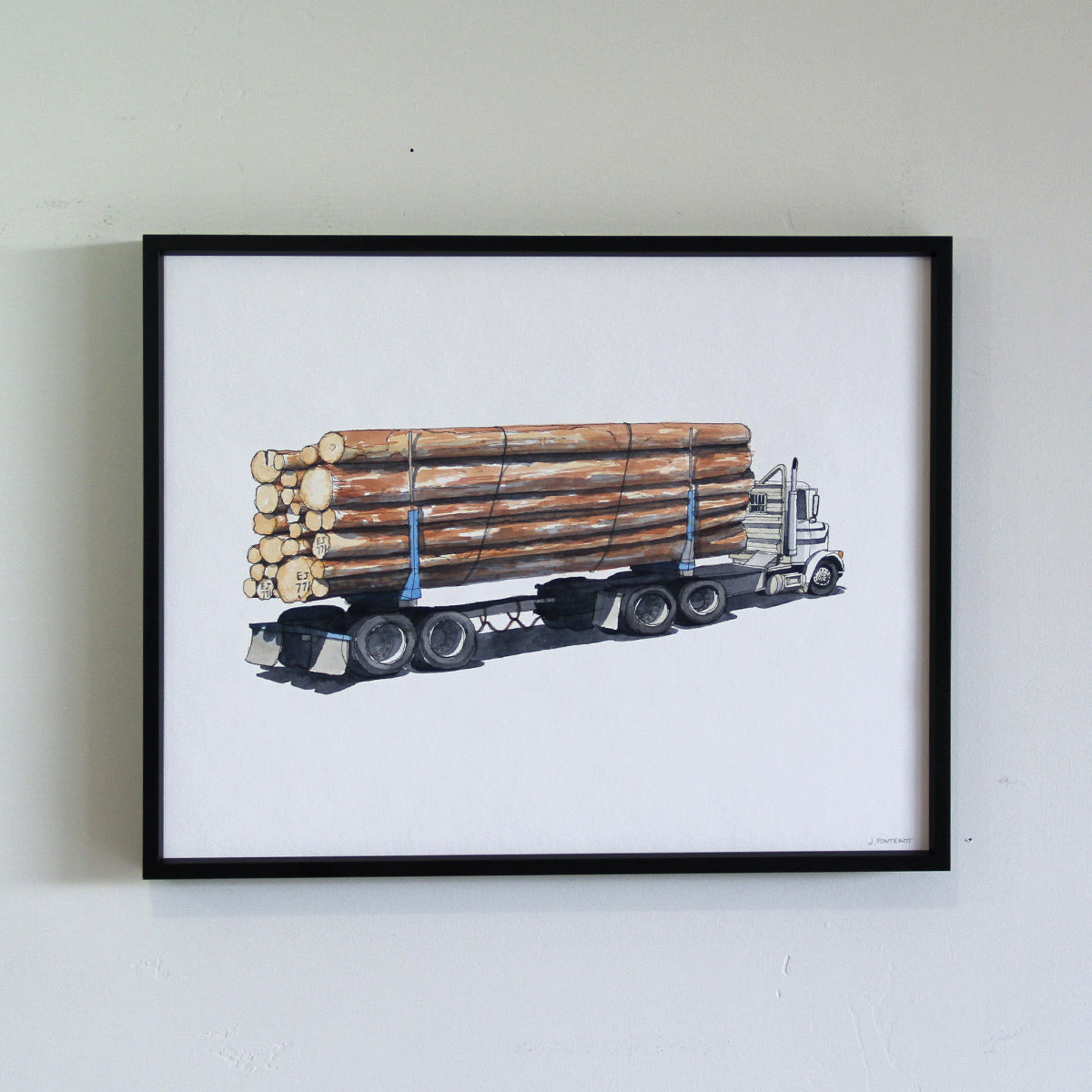 Framed original artwork hung on wall with thin black metal frame. Watercolor painting of logs cargo